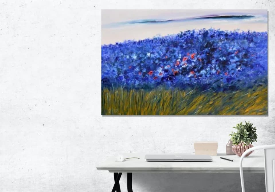 Field of Blooms: vivid blue flower field with red poppies over golden grass, pale sky. Original painting by Kim Kennedy.