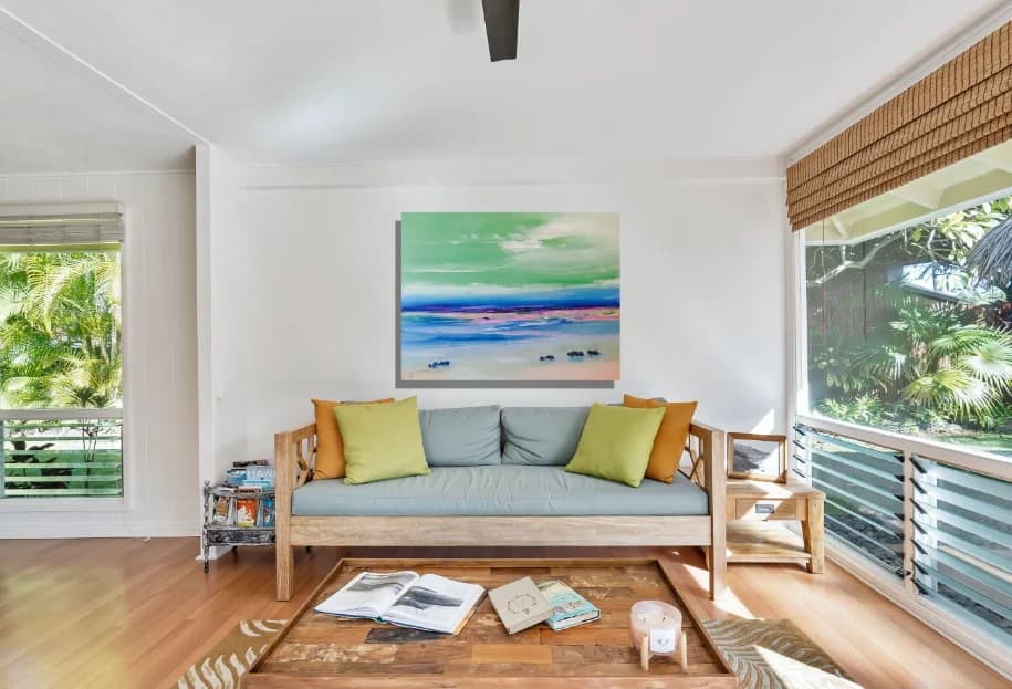 Scrub Trees to the north: green sky beach abstract with pink sand and blue sea, on lounge wall. Original painting by Kim Kennedy.